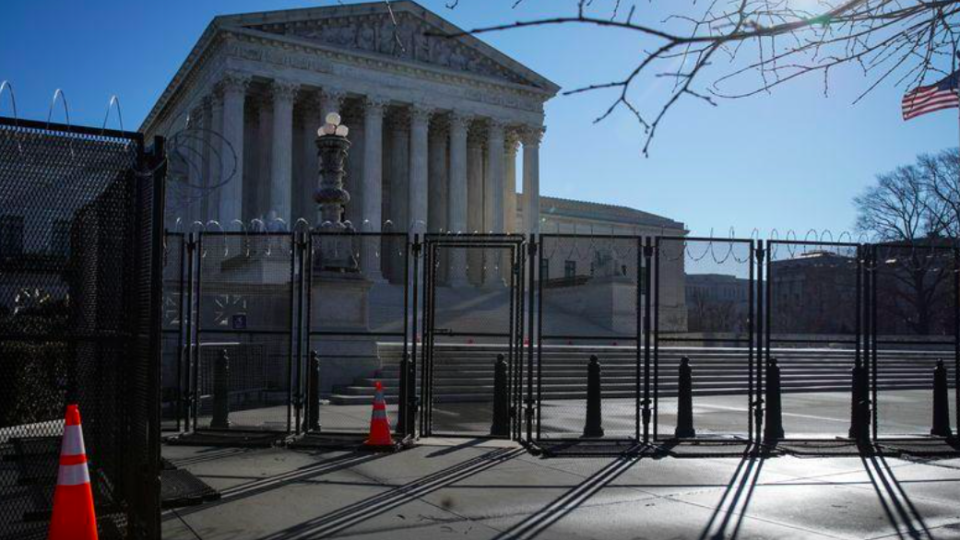 Barbed wire and security fencing surrounds the U.S. Supreme Court in Washington