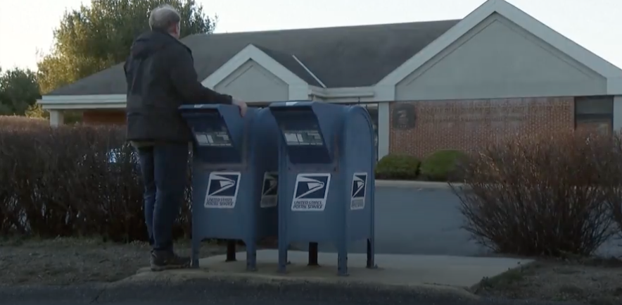 Gerald Groff, a Christian former postal worker in rural southeast Pennsylvania, standing by USPS mailboxes.