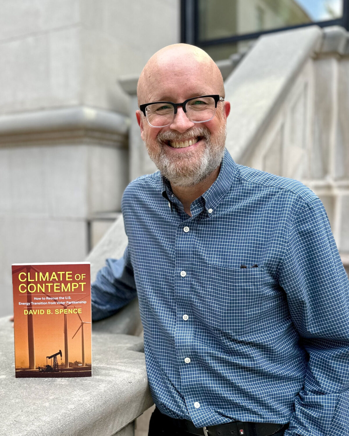 David Spence outside CCJ with his book