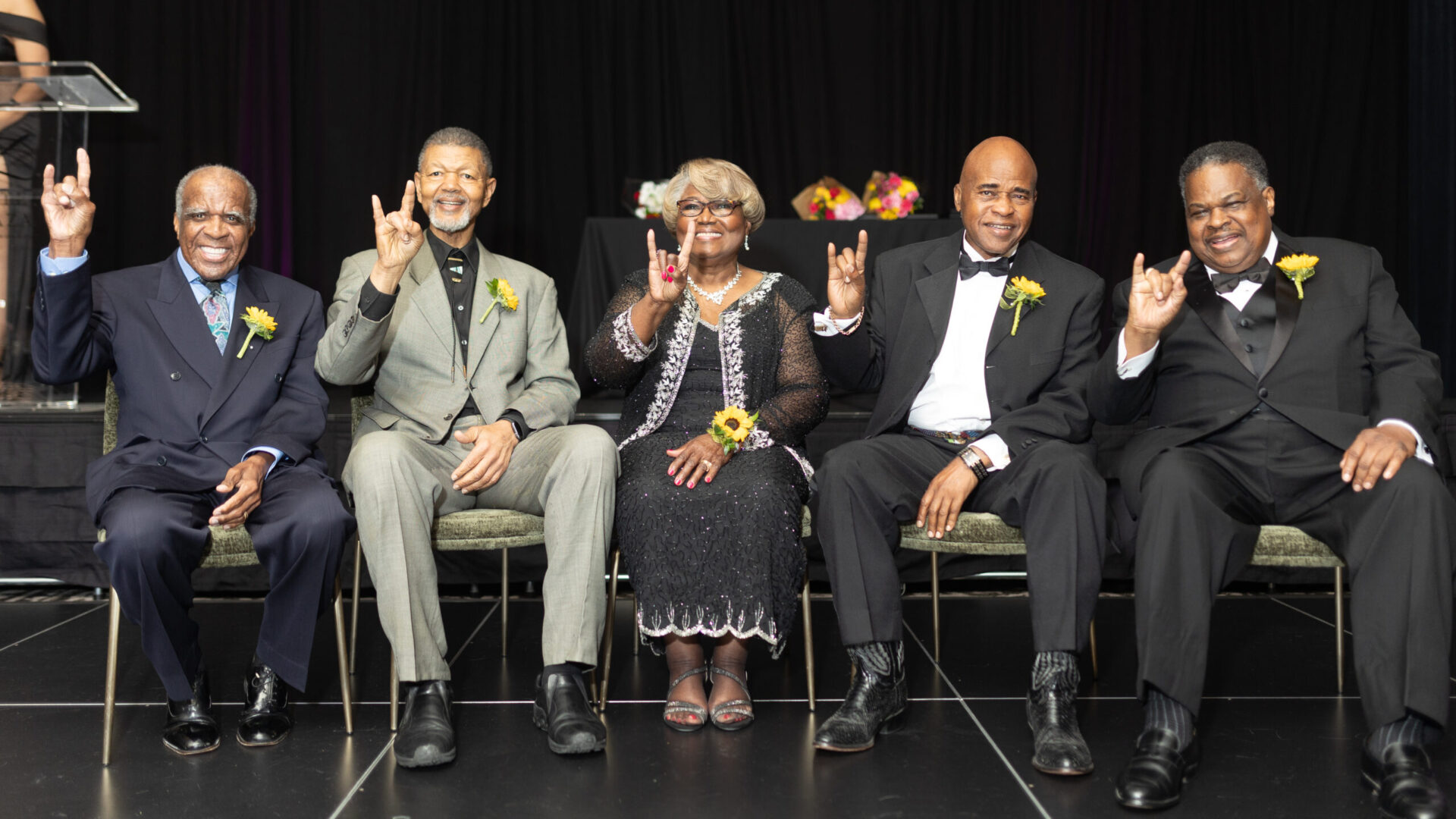 Photo of five people on stage