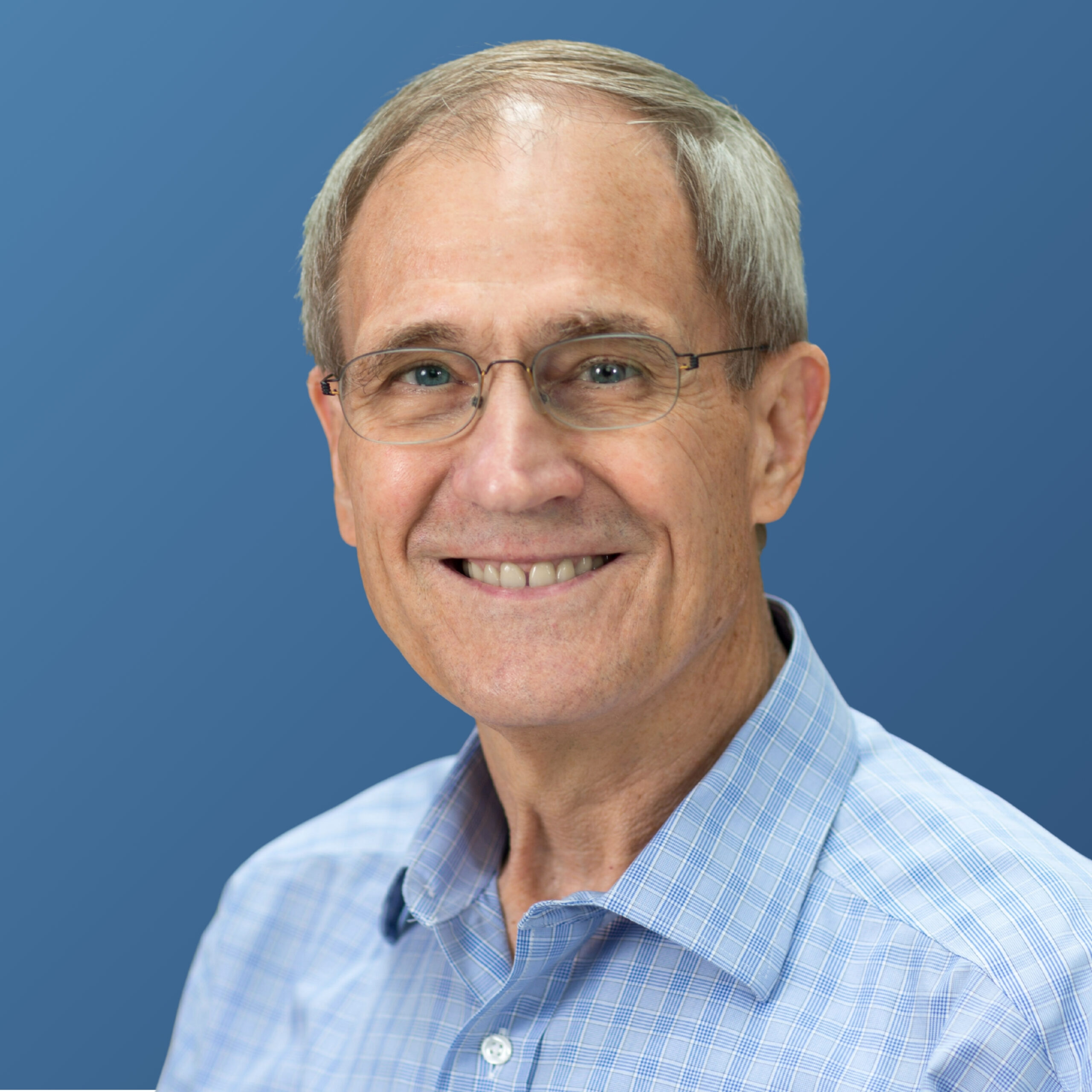 Tom McGarity Headshot with Blue Background