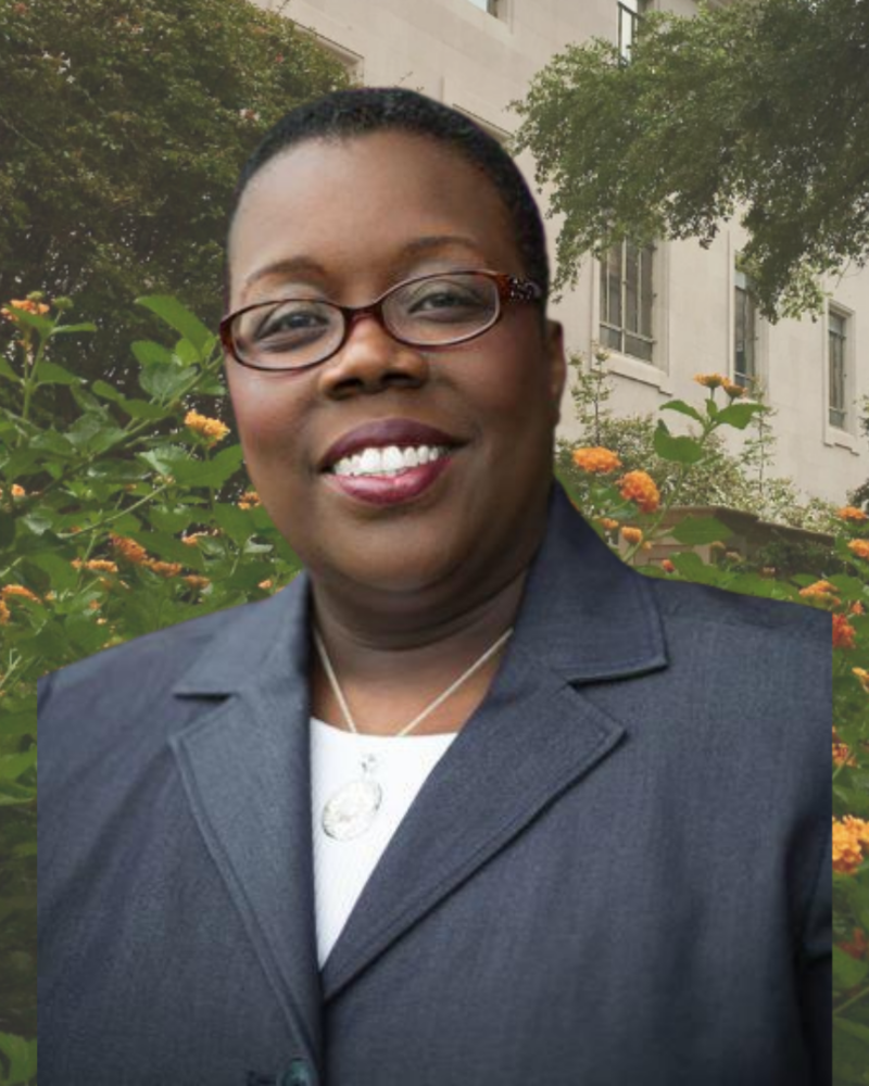 Portrait of Adrienne Nelson with yellow flowers in background