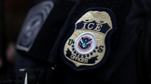 ICE badge on an officer's uniform