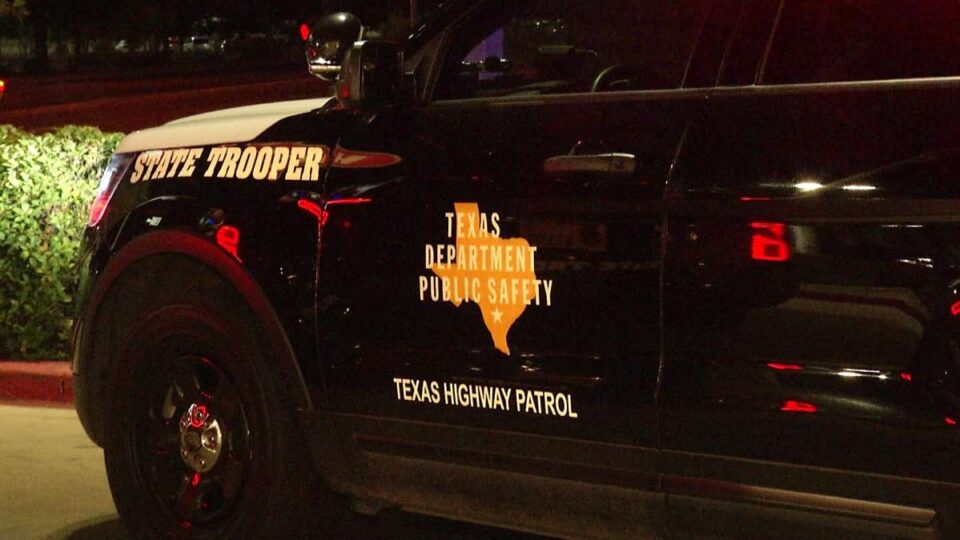 A Texas Department of Public Safety Texas Highway Patrol State Trooper car with its lights on