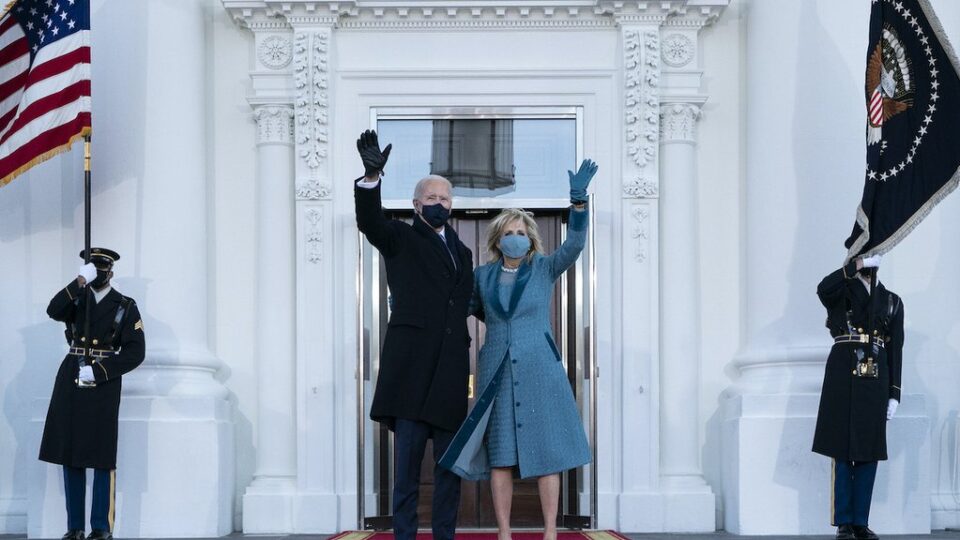President Joe Biden and first lady Jill Biden wave as they arrive at the North Portico of the White House, Jan. 20, 2021.