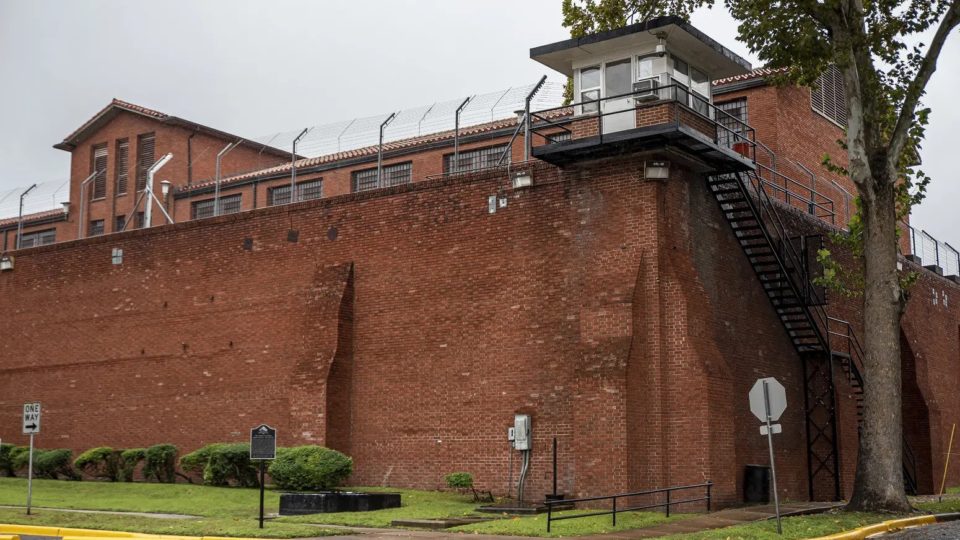 The exterior of a red brick prison