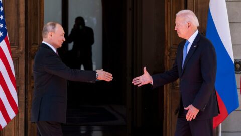 President Biden and Vladimir Putin shaking hands