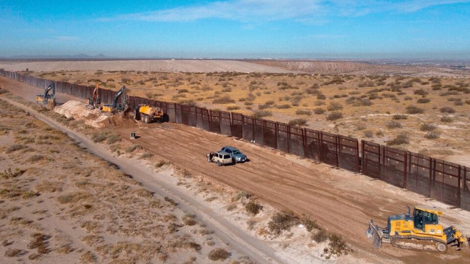 U.S. workers building the new 13-mile border wall construction project at the desert between Sunland Park, New Mexico, U.S. and Ciudad Juarez, Chihuahua state, Mexico, on January 8, 2021.