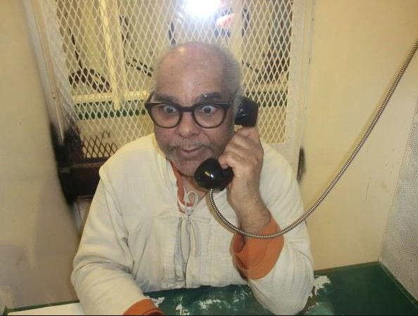 Raymond Riles on the phone in prison.
