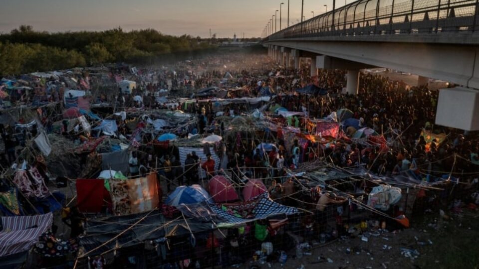 Immigrants under a Texas bridge