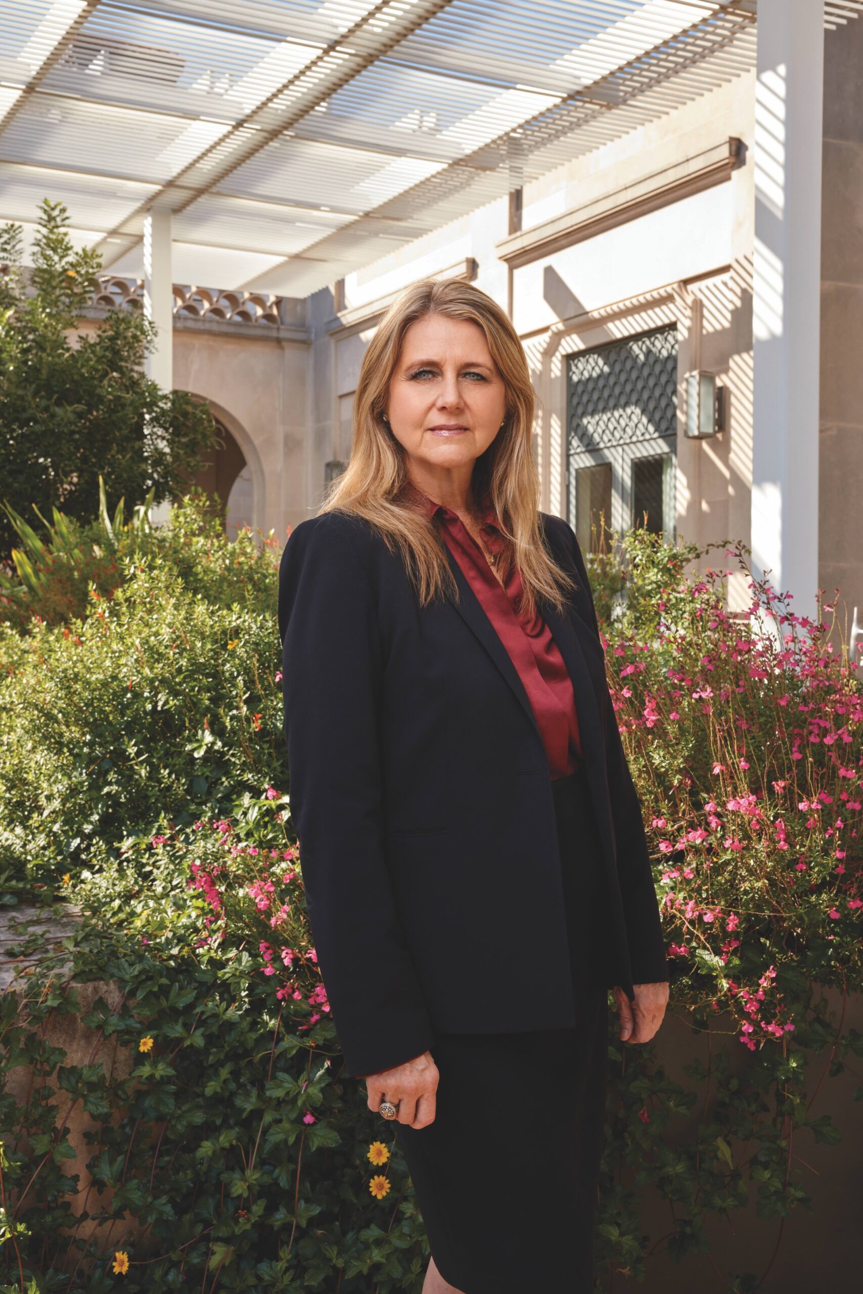 Mindy Montford outside of the Texas Law building with greenery