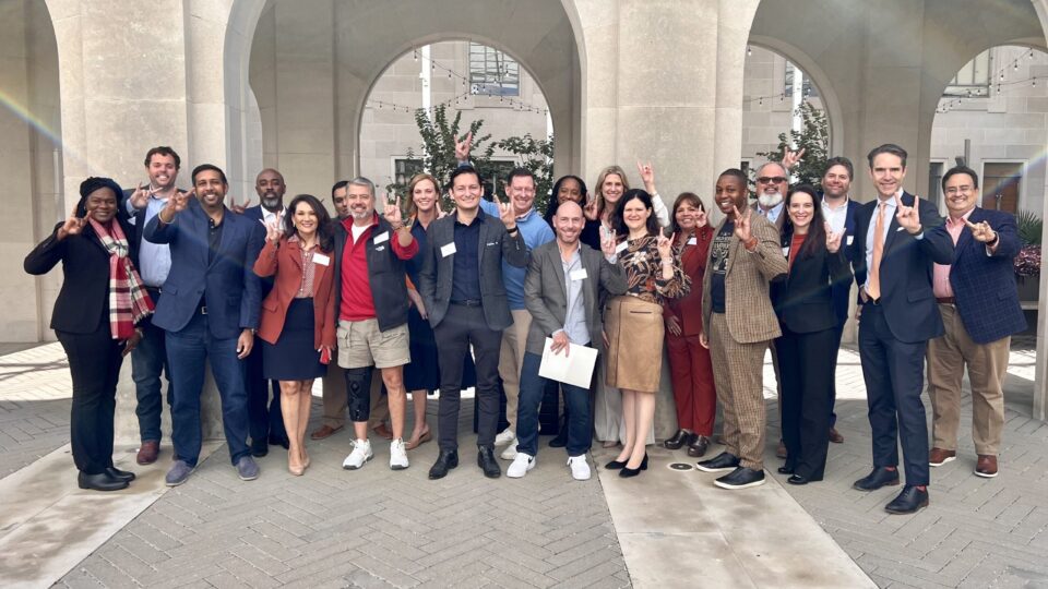 AAEC members standing with Dean Bobby Chesney in the Patman Family Plaza