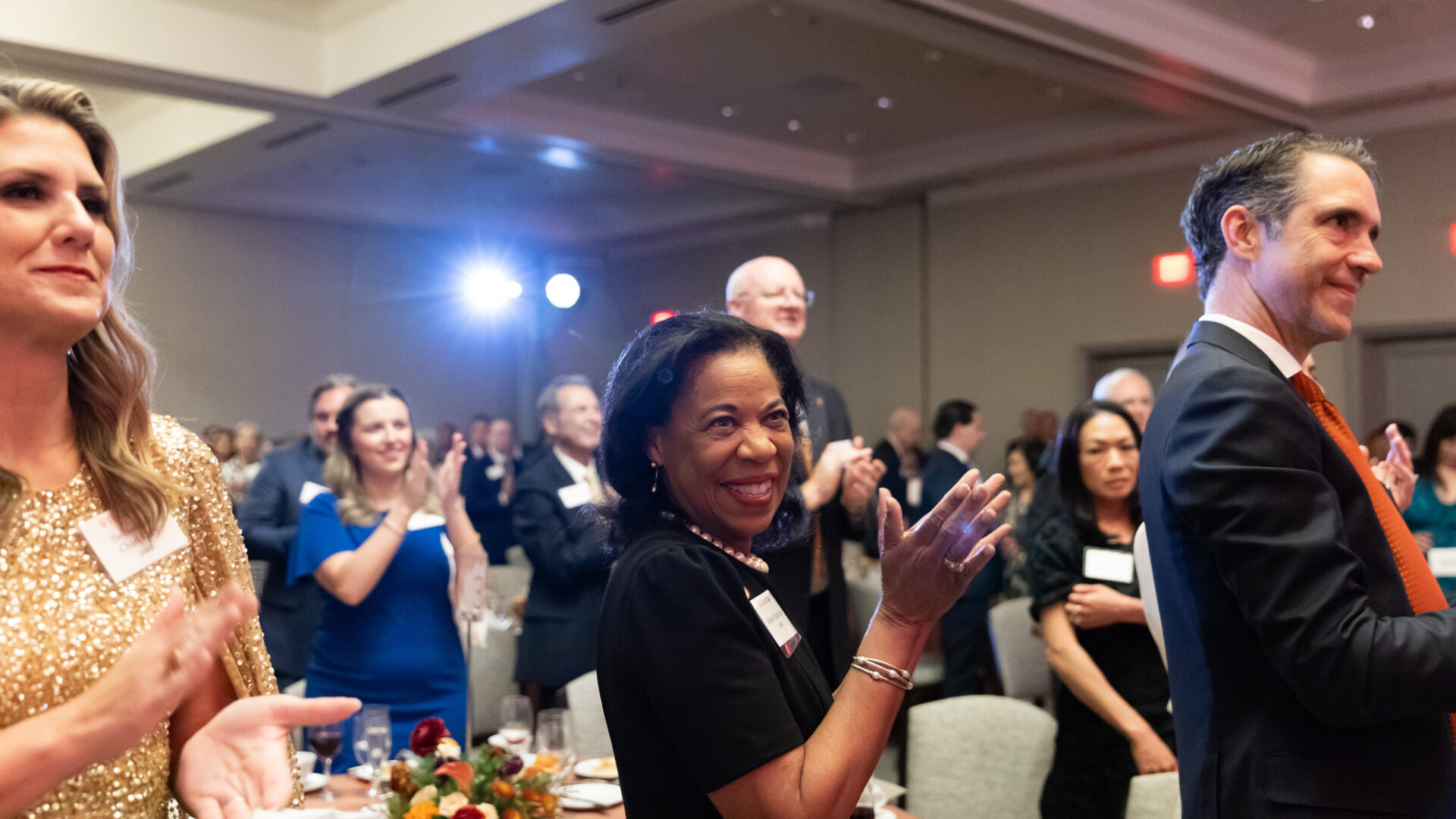 Alumni and Faculty cheering at the 2025 Alumni Awards