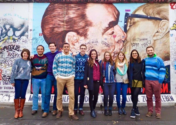 students in front of mural