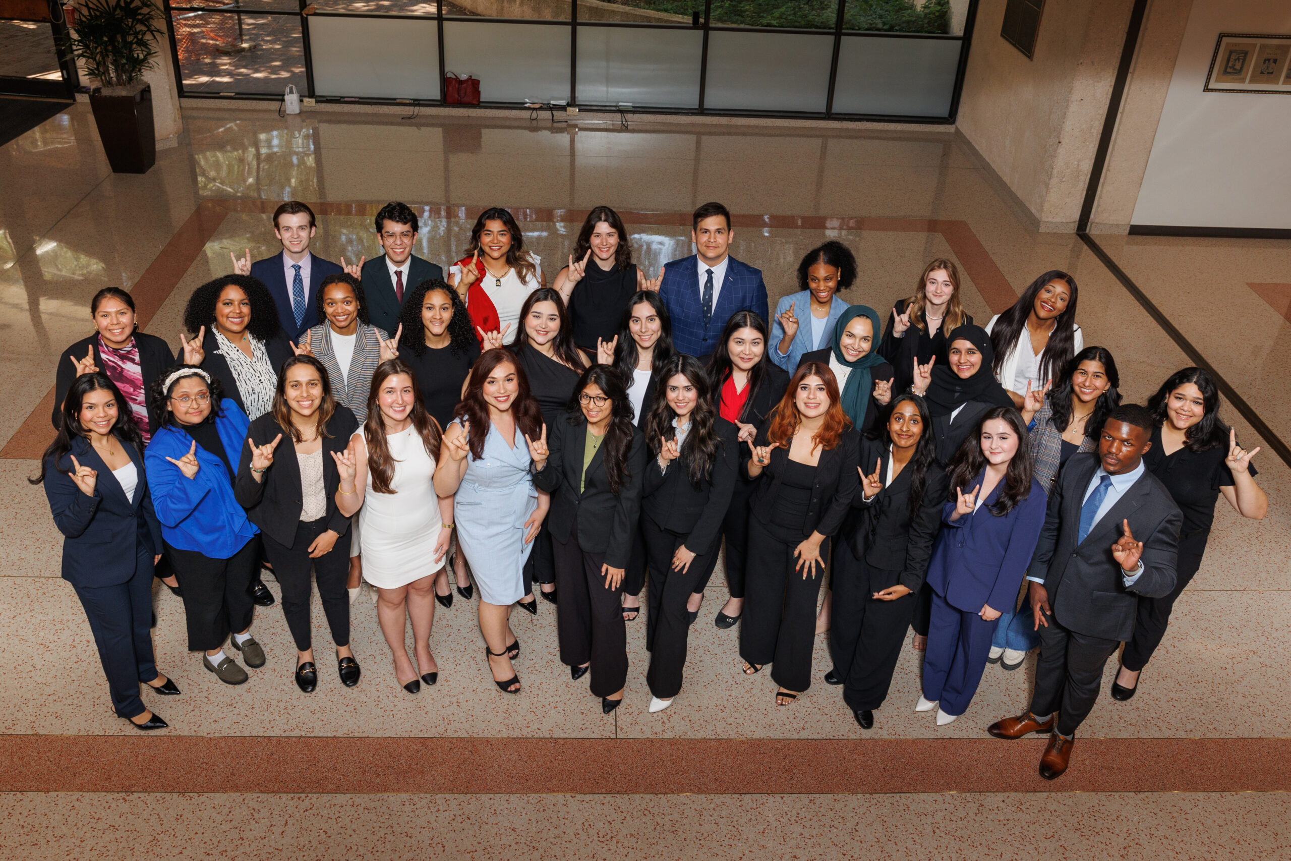 The 2024-25 pipeline cohort pictured in the Texas Law atrium.