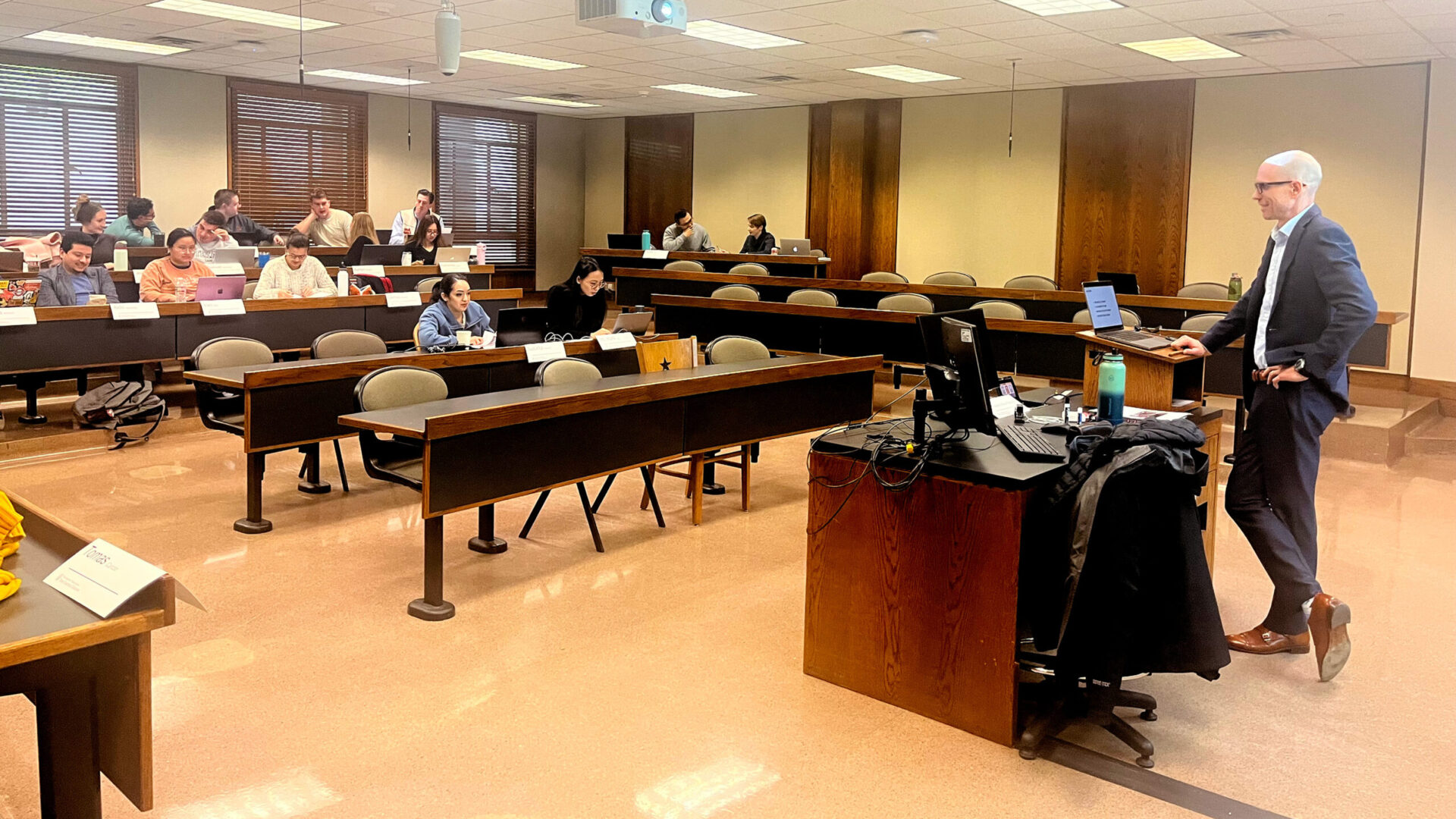 Professor standing, facing classroom for Accelerated Business Fundamentals Bootcamp.