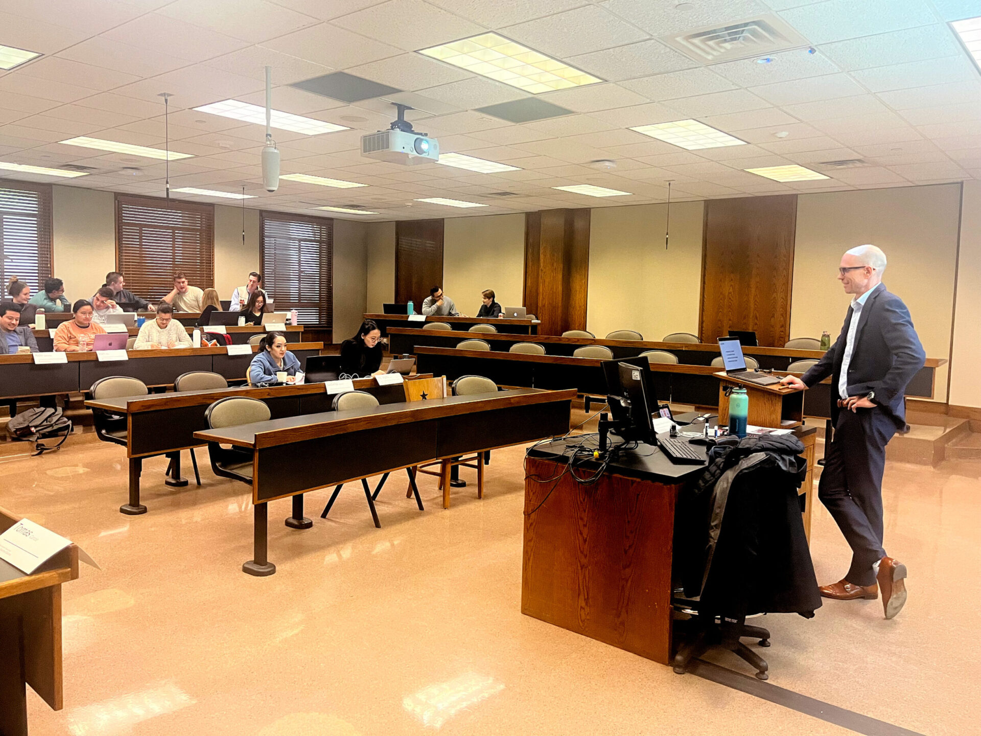 Professor standing, facing classroom for Accelerated Business Fundamentals Bootcamp.