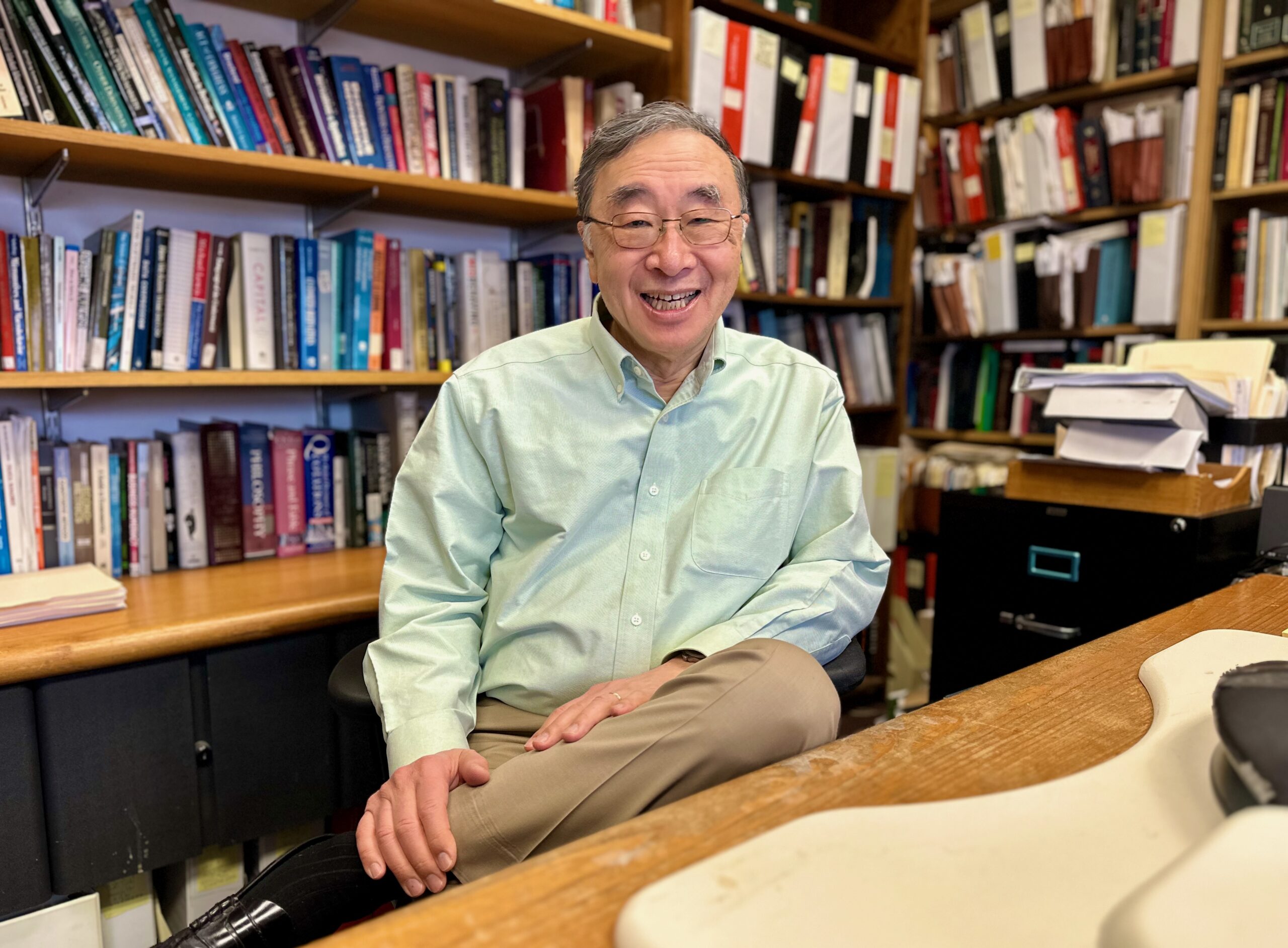 Portrait of Professor Henry Hu in his office